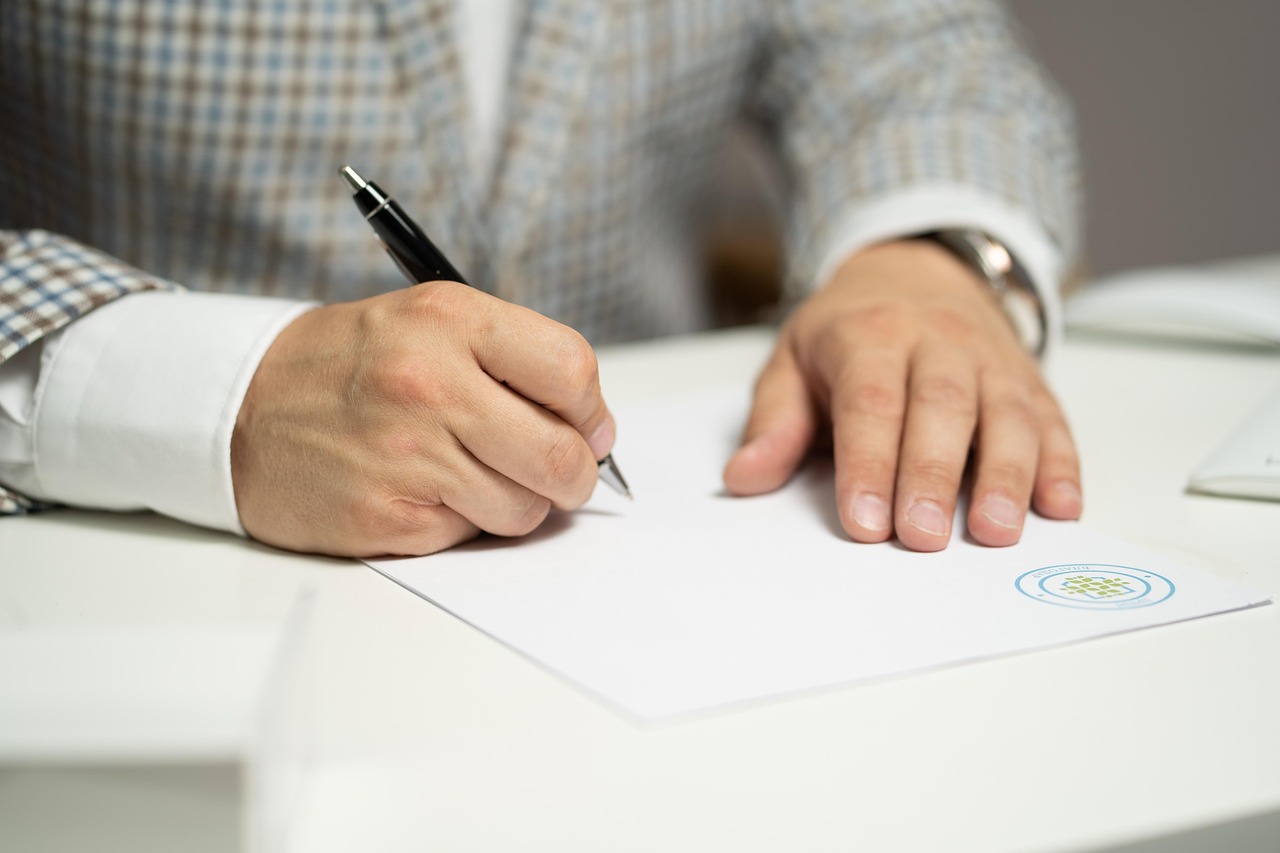 Garage business owner reviewing insurance certificate requirement