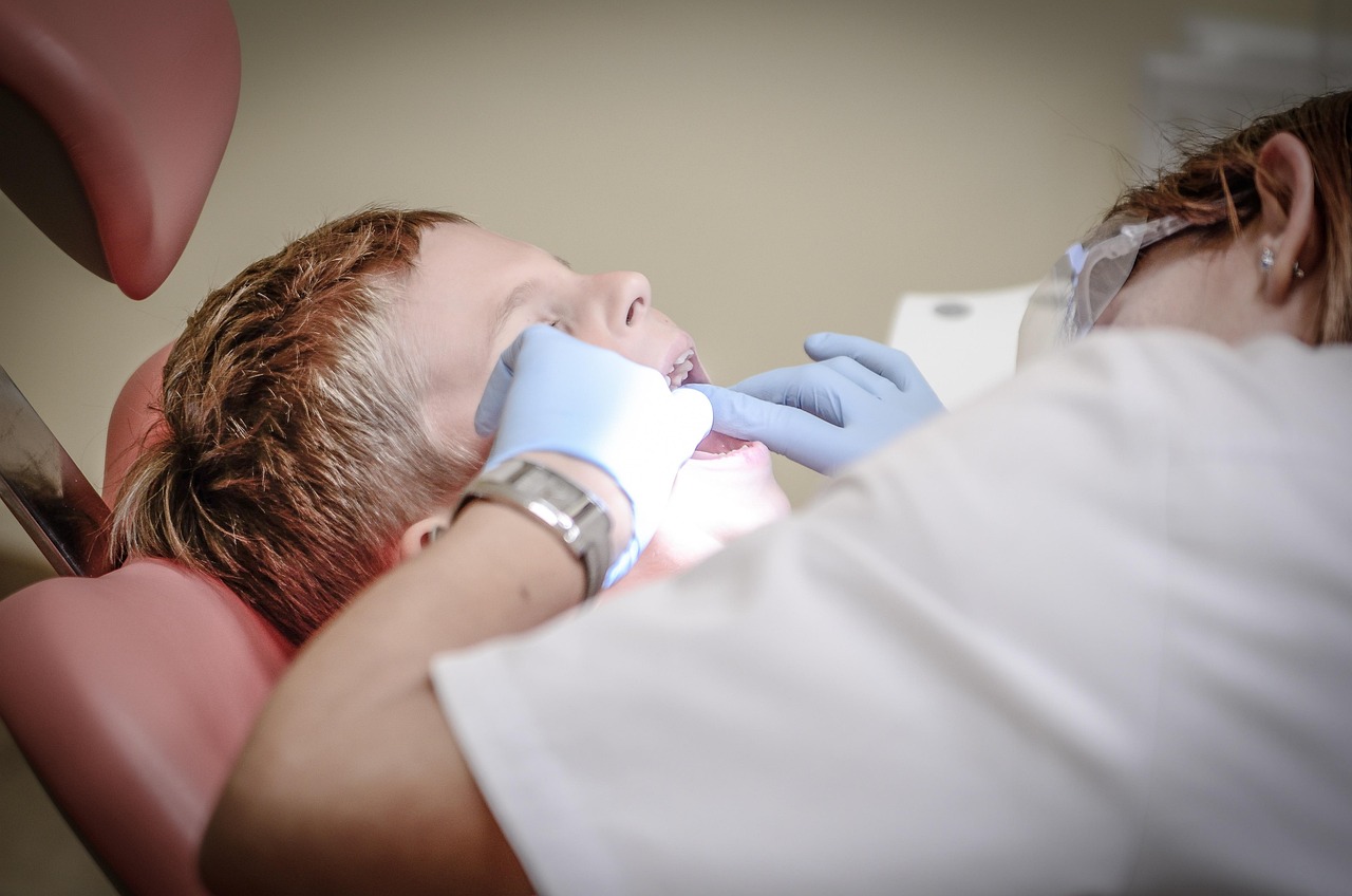 Dentist treating a patient in a dental office