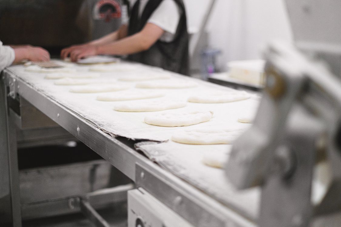 Food processing facility workers on a production line