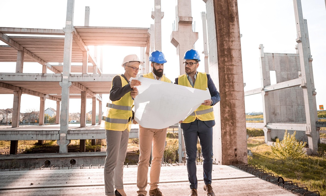 Construction crew working together on a job site representing employees covered by workers compensation