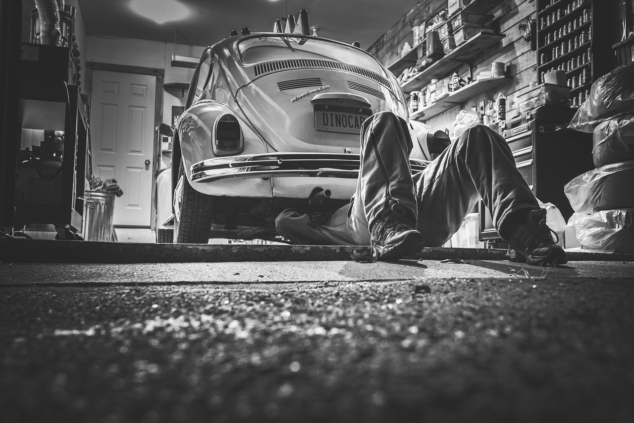 Mechanic reviewing Travelers auto repair shop insurance through Casurance