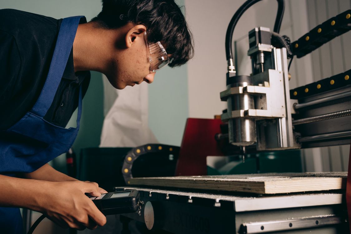 CNC machine shop equipment on a fabrication floor