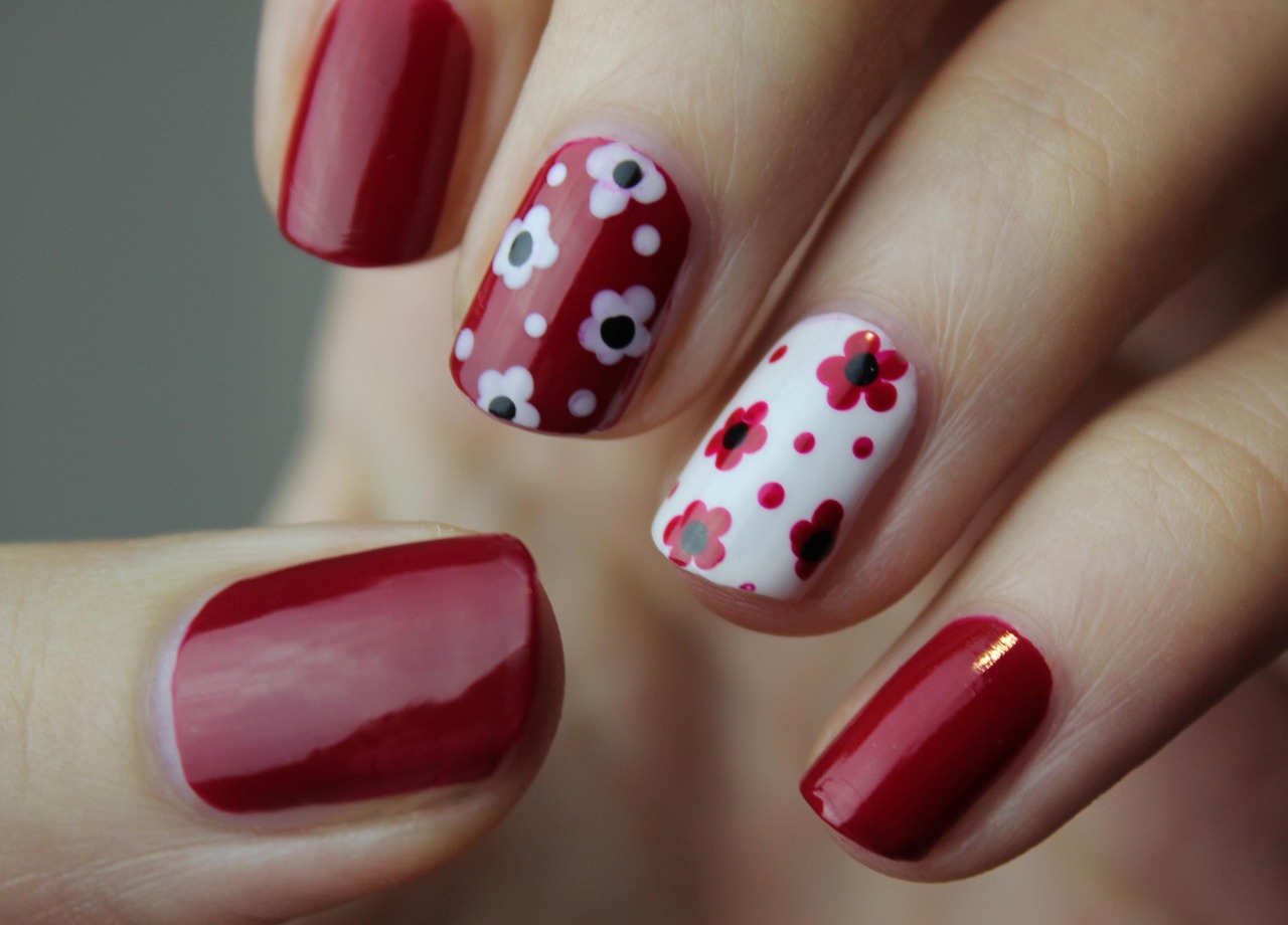 Nail technician performing a manicure on a client