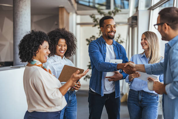 Payroll and HR team members working together in an office