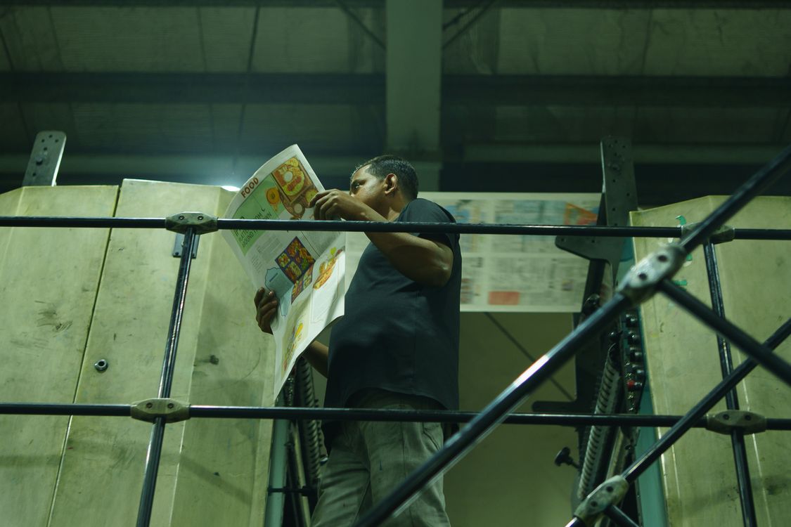 Commercial printing press in operation