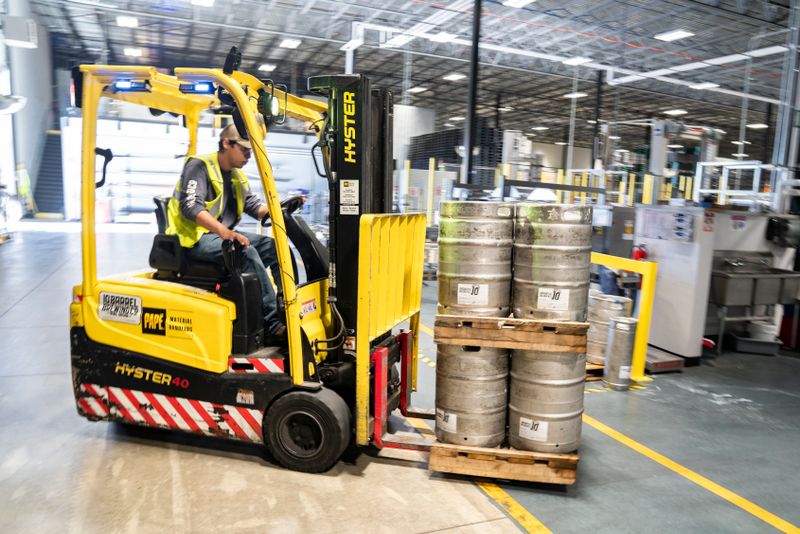 Warehouse worker operating a forklift for distribution