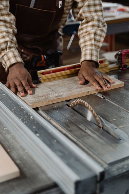 Carpenter working on a woodworking project in a workshop
