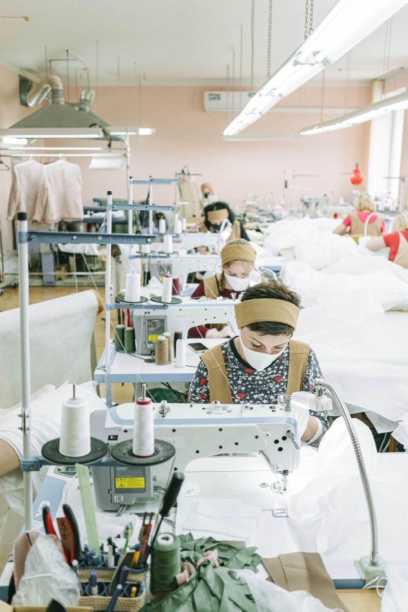 Workers operating sewing machines in a textile factory